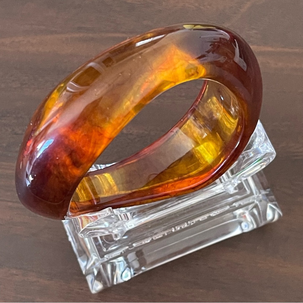 Vintage asymmetrical design chunky Amber color lucite bangle.